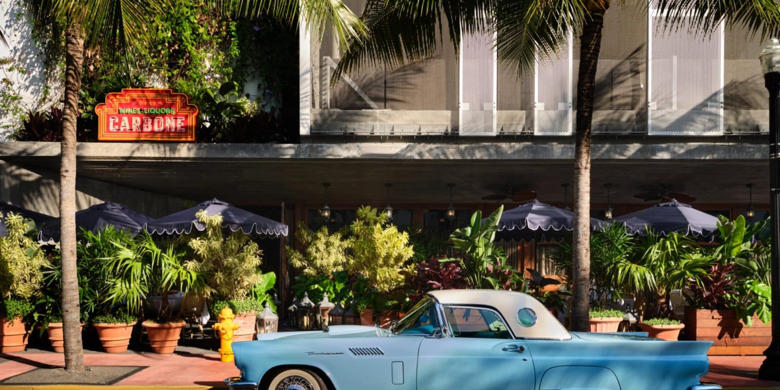 Carbone Miami restaurant exterior and vintage car on Collins Avenue