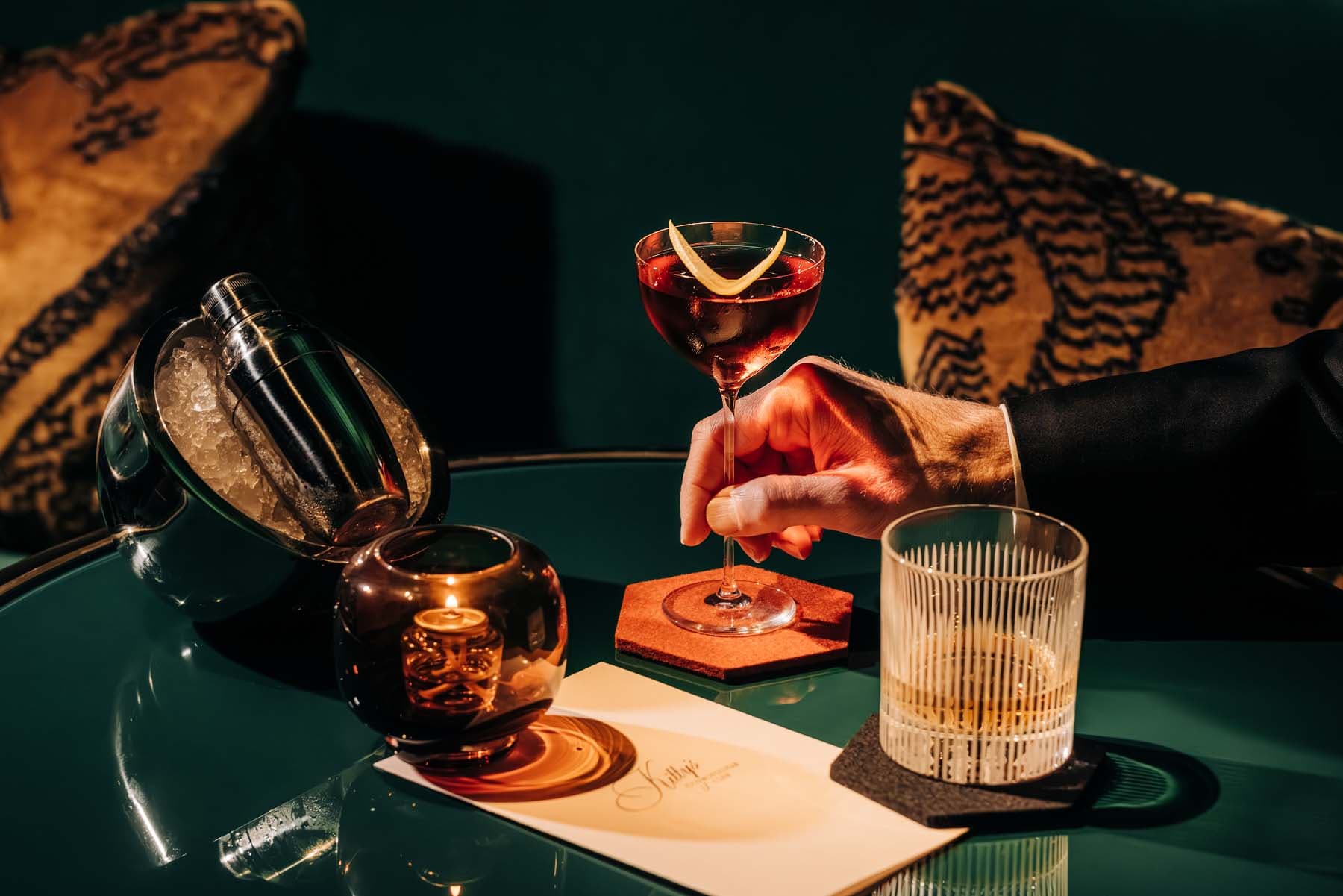 Cocktails arranged in a moody Chicago lounge dining room