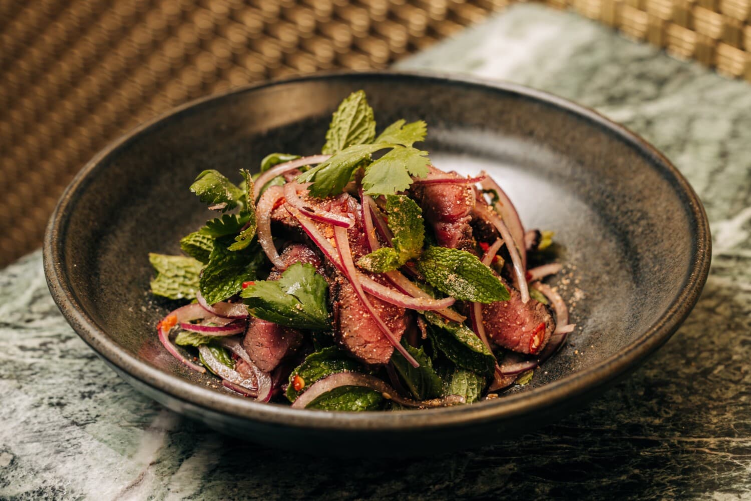 A composed beef salad dish from Crying Tiger in Chicago