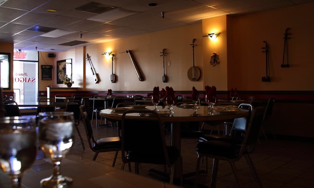 A warmly lit restaurant interior that fits Washington D.C.'s late-May opening buzz