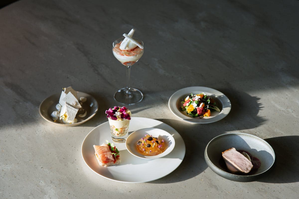 Elegant fine dining dishes beautifully plated on a gourmet restaurant table in Los Angeles