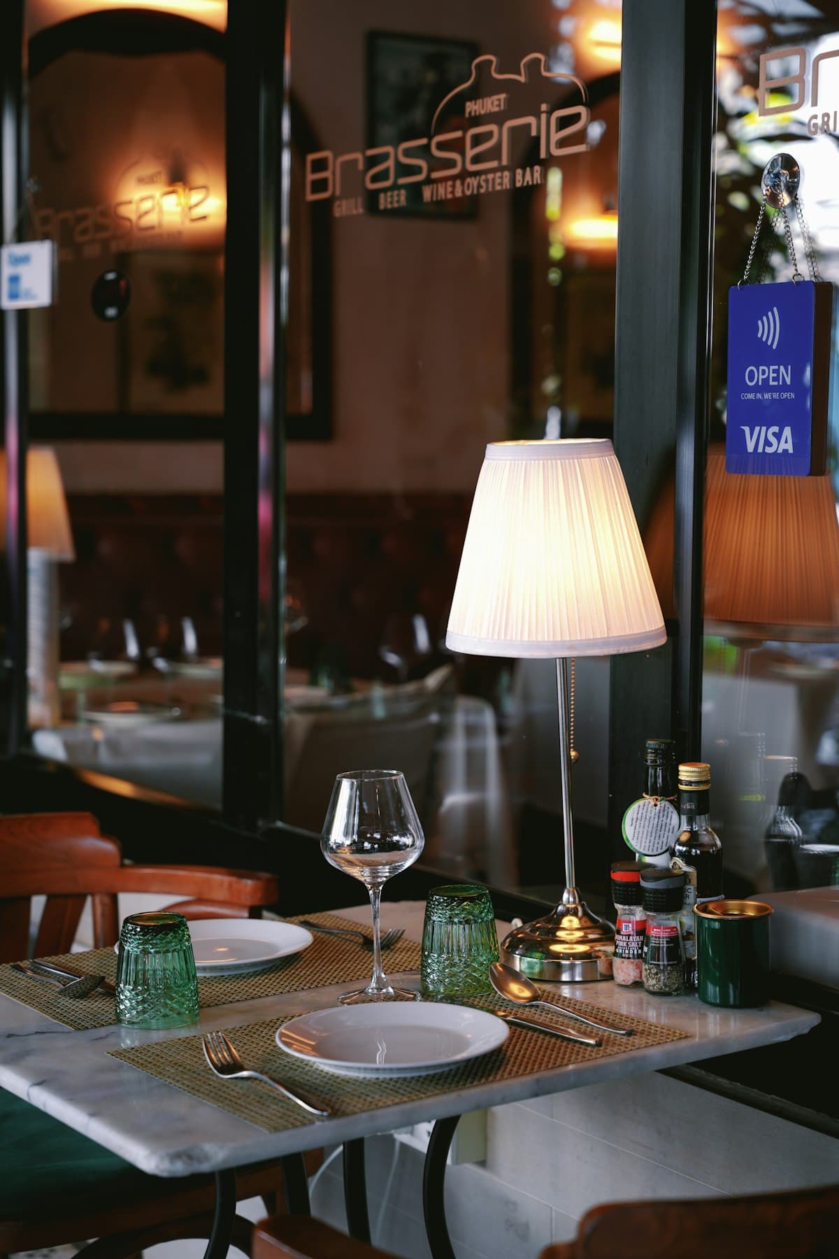 Elegant French brasserie table set inside a refined dining room