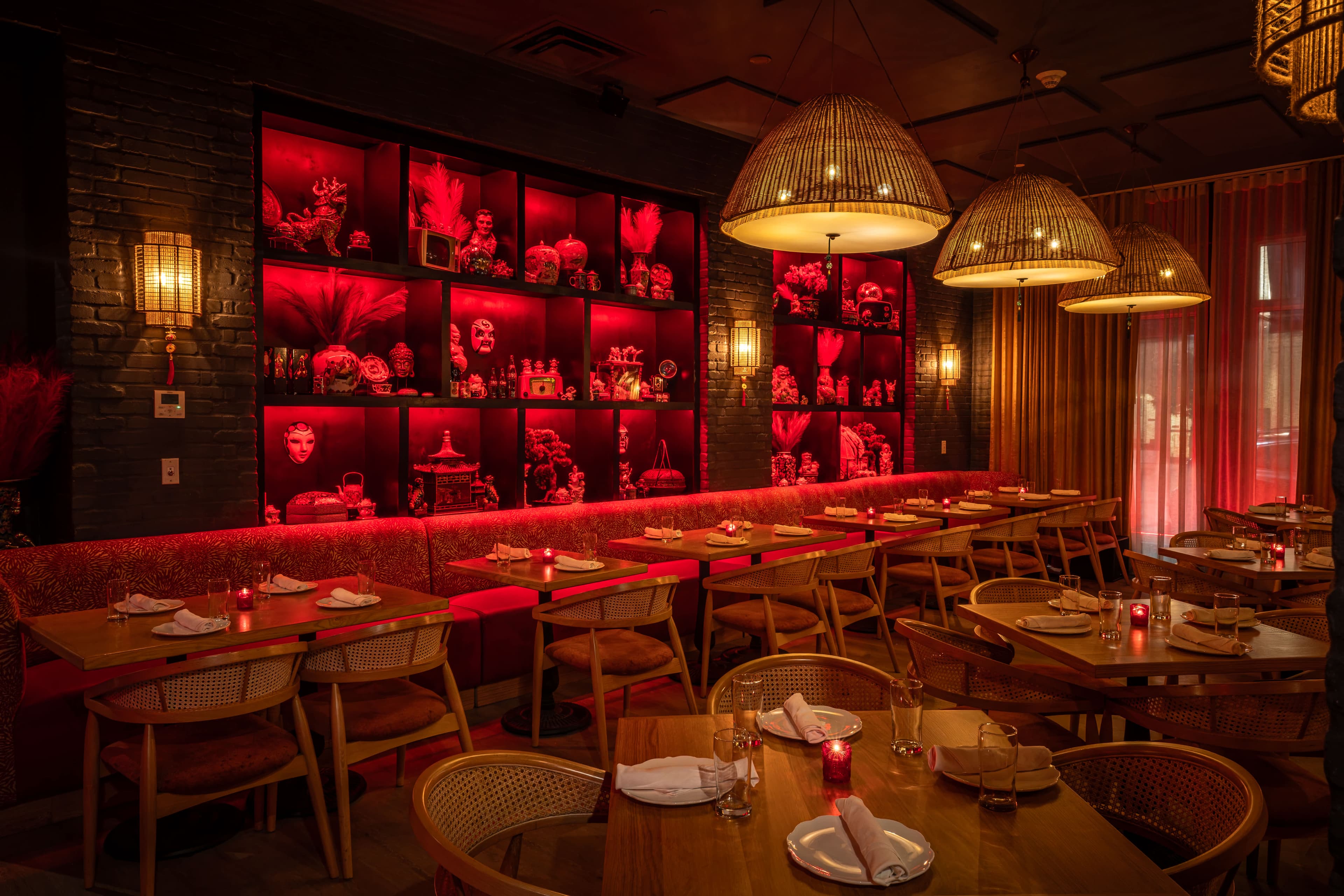 A moody Miami dining room with warm lighting, cocktails, and late-night energy