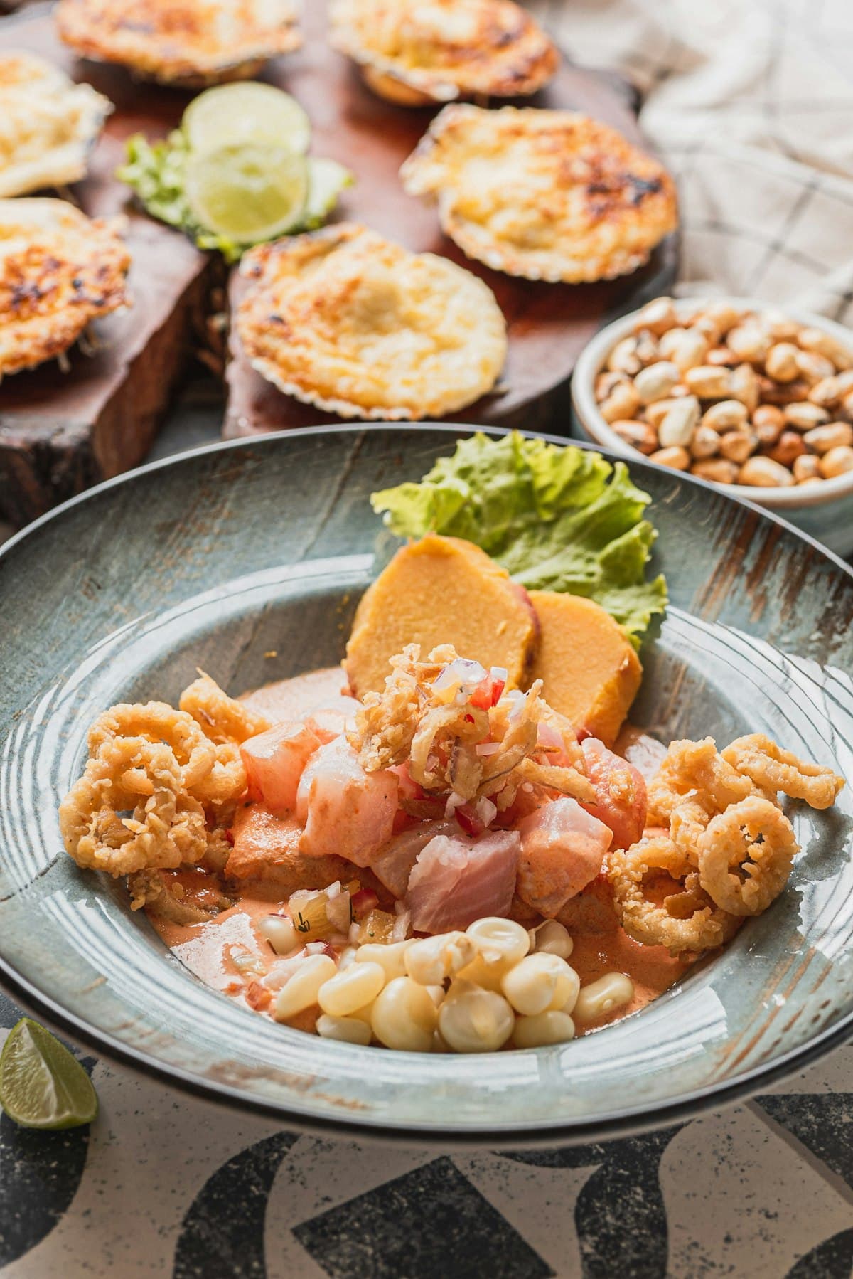 Peruvian seafood and colorful plates on a restaurant table