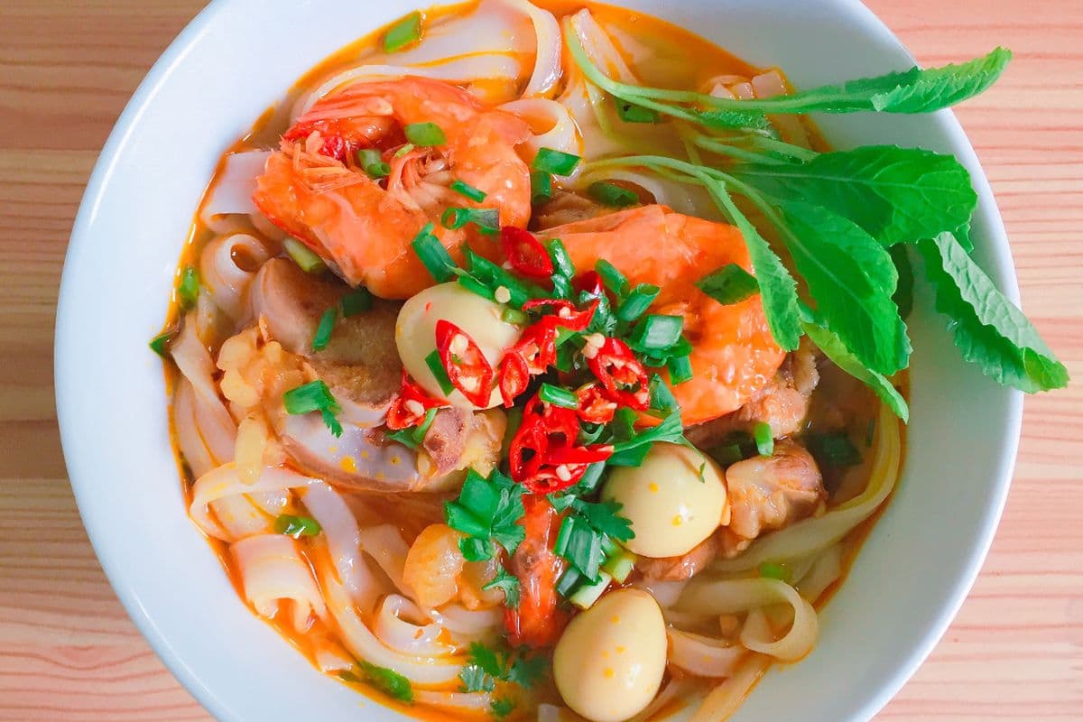 Thai dishes with herbs and vegetables served for sharing